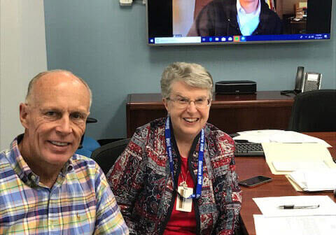 From left: Brother Craig Franz, FSC; Sister Joan Mumaw, IHM, Friends in Solidarity chief administrative officer, and the Rev. Robert Dowd, CSC (on screen).