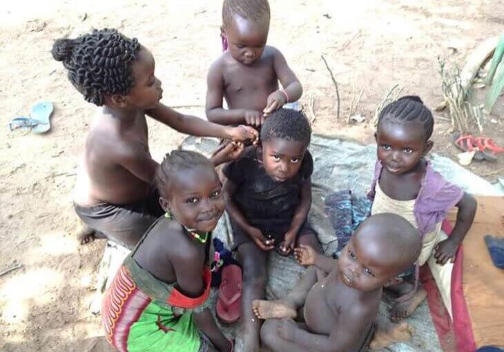 South Sudan children sitting on ground