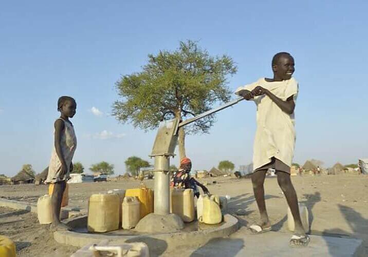 South Sudanese pumping well water