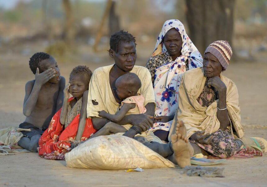 A family newly arrived at an internally displaced persons camp in Manangui, South Sudan. Families started arriving here shortly after fighting broke out in December 2013, and new arrivals continued to appear three months later as fighting drug on. Many, like these people, are living in the open and under trees. The ACT Alliance is providing the displaced families and the host communities affected by their presence with a variety of support.